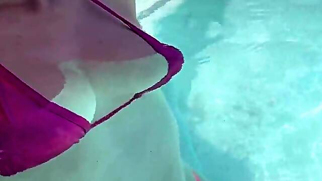 Artemisia Love dressed in a wondrous bathing suit in the outdoor jacuzzi
