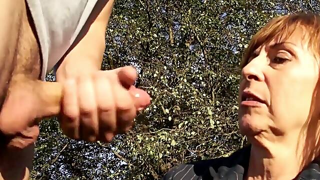 Mature redhead gives head in public and likes being taped